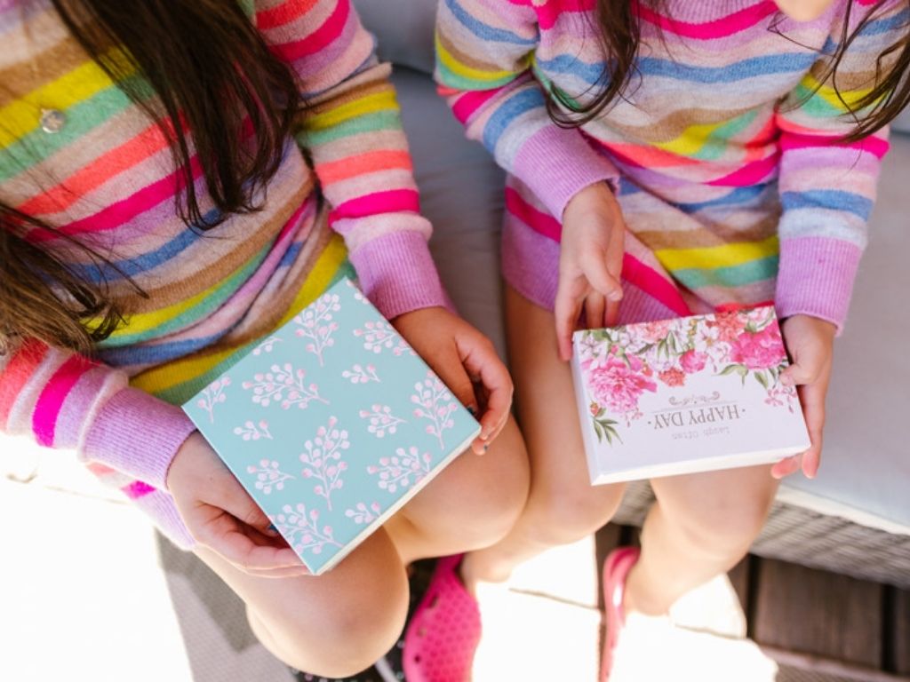 Girls holding gifts