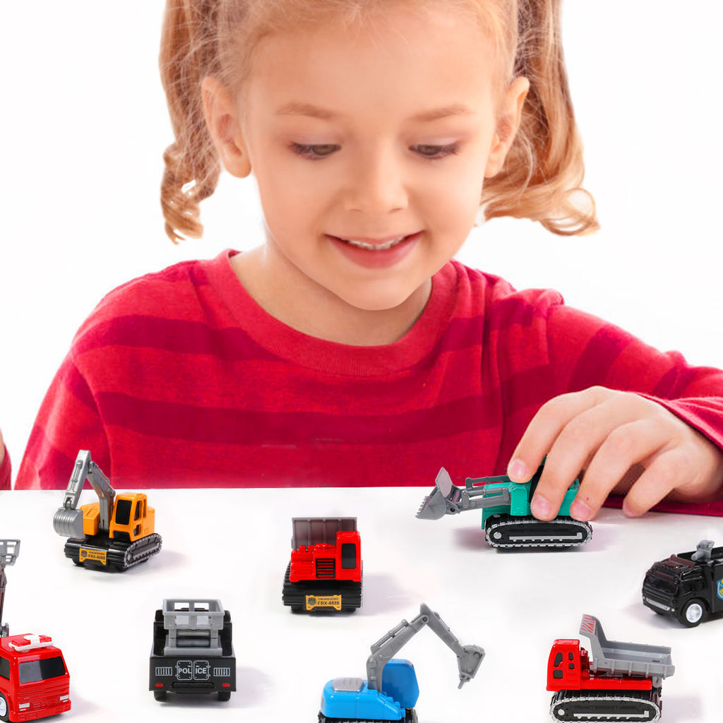 A girl playing with a construction toy trucks with play mat for toddlers
