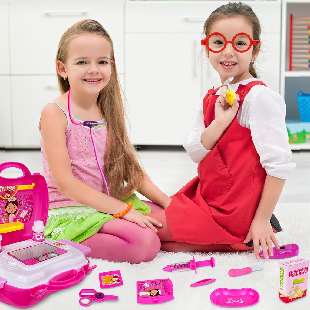 2 girls playing the doctor and patient with the Kids doctor play set