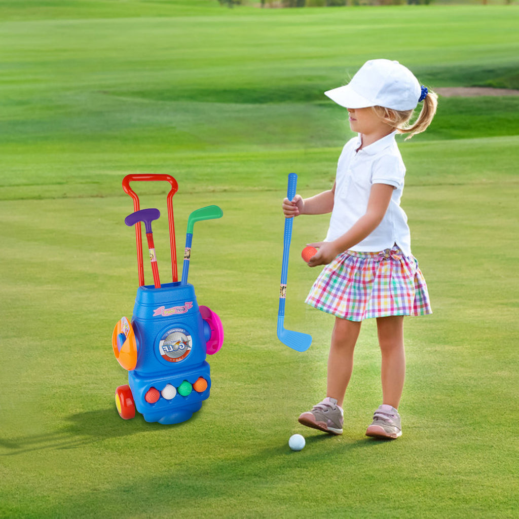 A girl and the colorful kids golf club set in a golf course