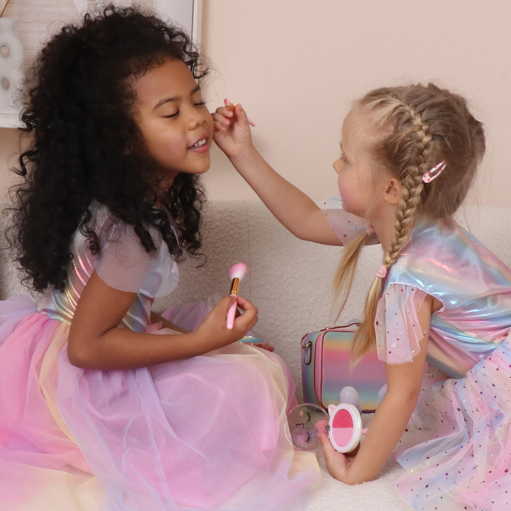 Girls playing makeup toys together