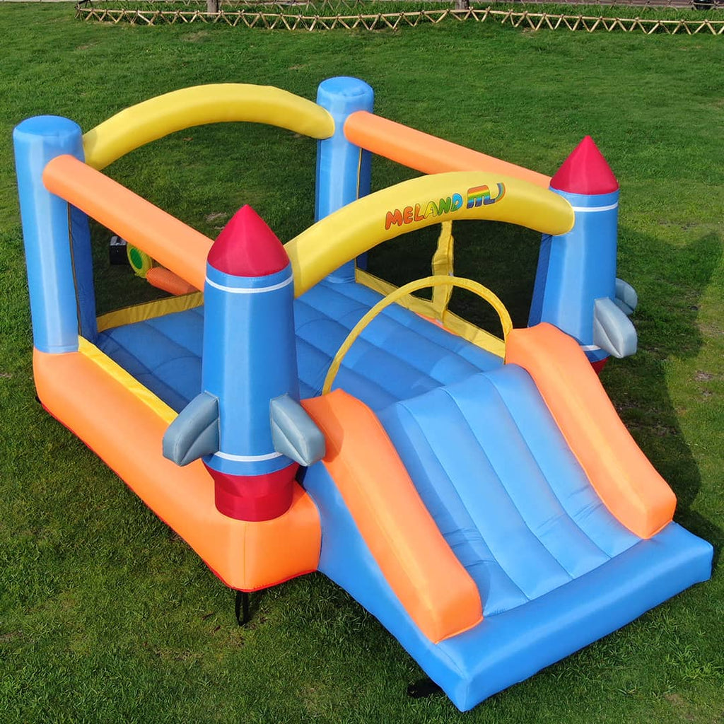 The Kids Inflatable bounce house with heavy-duty blower and slide in a garden