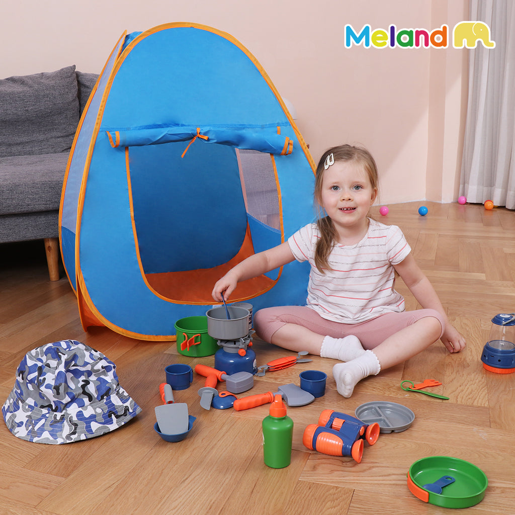 A girl outside the camping and outdoor set with all the different items provided.
