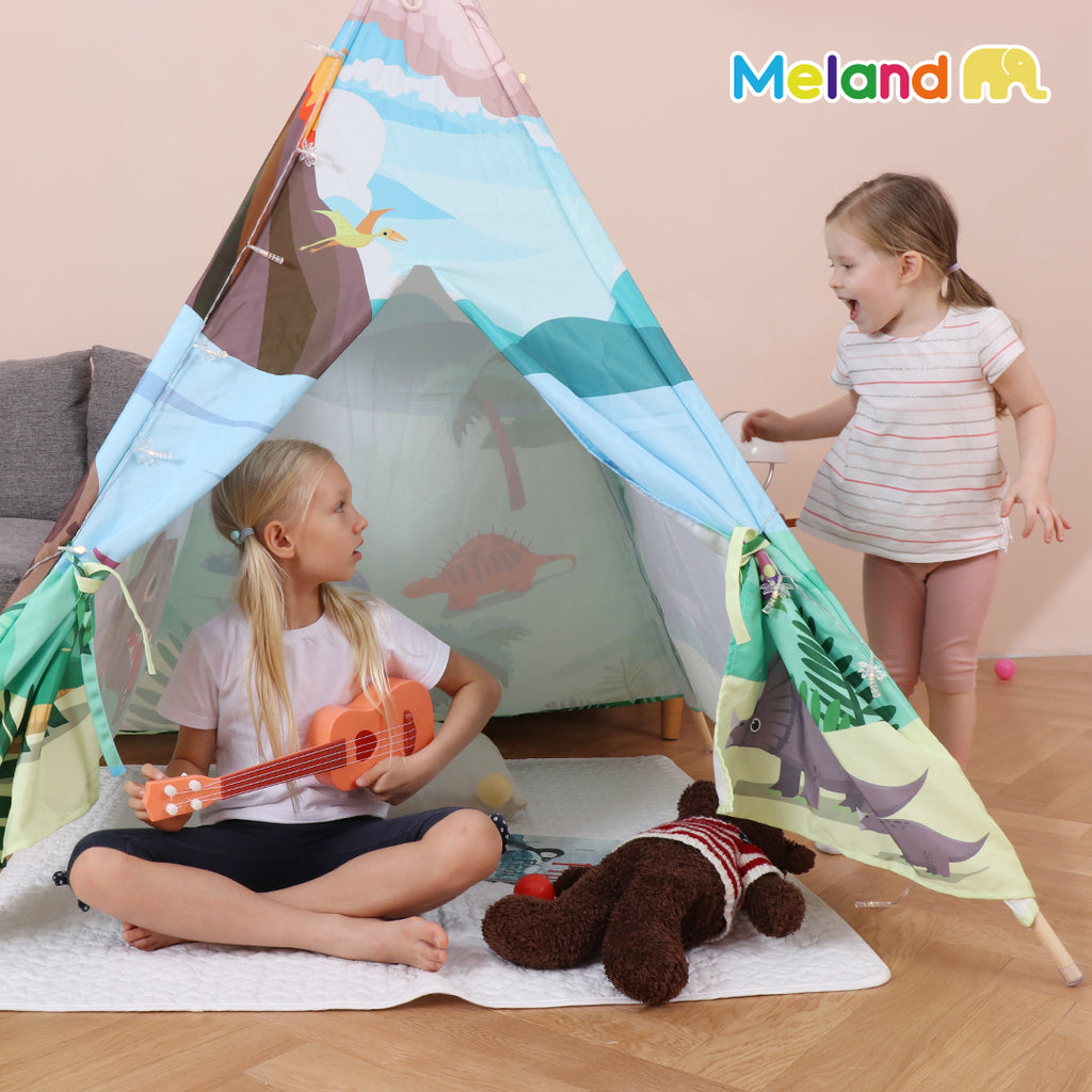 Two little girls playing inside the dinosaur play tee tent