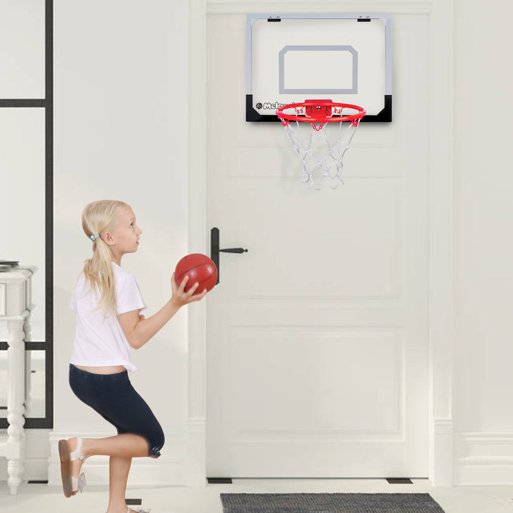 A girl playing with the Indoor Basketball Hoop