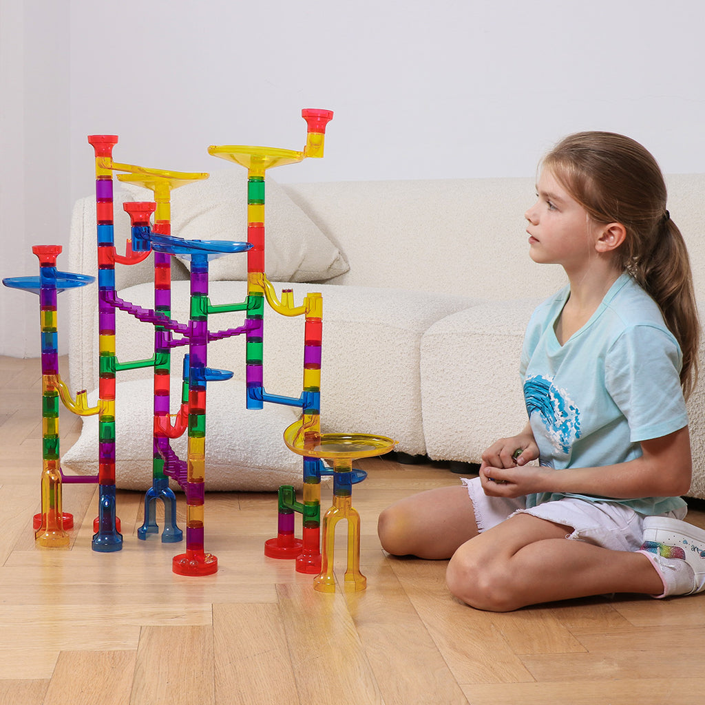 Girl playing with the 132 piece marble run