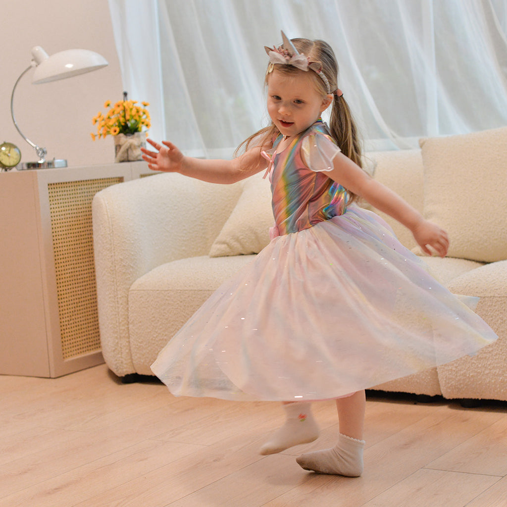 A girl dancing with the unicorn princess dress